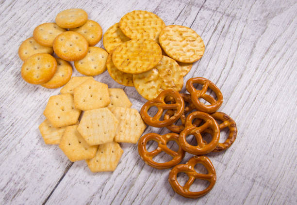 istock Mix of snacks : pretzels, crackers, cookies. 944324192