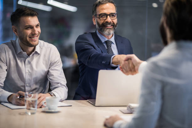 istock Human resource team congratulating a candidate on successful job interview. 944325040