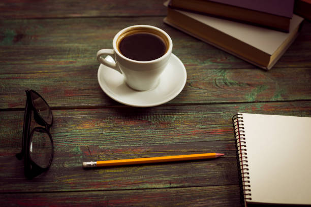 istock A cup of coffee in the workplace on a wooden table. 944325338