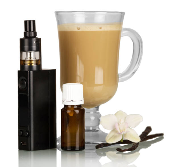Electronic cigarette, cappuccino Cup, Orchid flower and vanilla pod, isolated on white