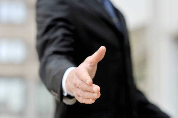 istock Businessman offering his hand for handshake 944333466