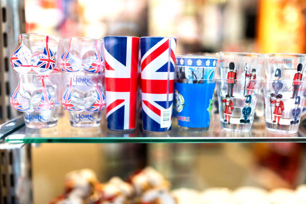 A London souvenir shop displaying English shot glasses with the union jack, keep calm and carry on and beefeater and London Tower Guards printed on them in the UK A London souvenir shop displaying English shot glasses with the union jack, keep calm and carry on and beefeater and London Tower Guards printed on them in the UK London Memorabilia stock pictures, royalty-free photos & images