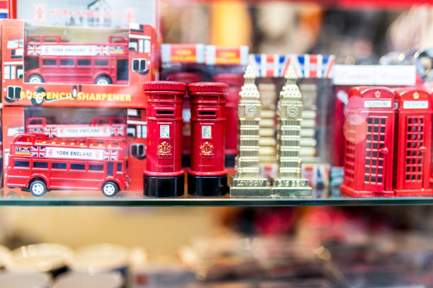 A London souvenir shop displaying British souvenirs including London buses, British red post boxes, Big Ben ornaments and red British telephone boxes on a shelf in the UK A London souvenir shop displaying British souvenirs including London buses, British red post boxes, Big Ben ornaments and red British telephone boxes on a shelf in the UK London Memorabilia stock pictures, royalty-free photos & images