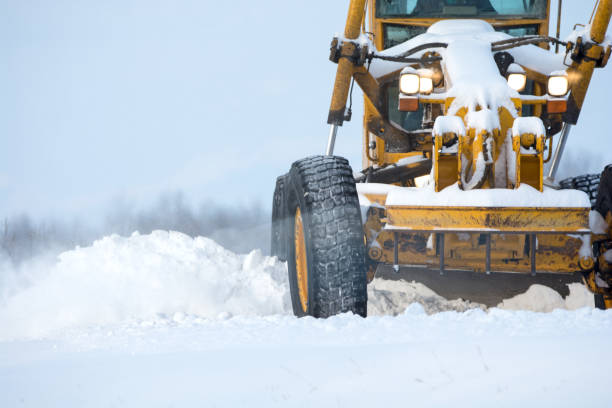 istock Close-up of a road grader removing snow 944348640