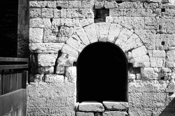 opened gate in medieval castle at sunset time.