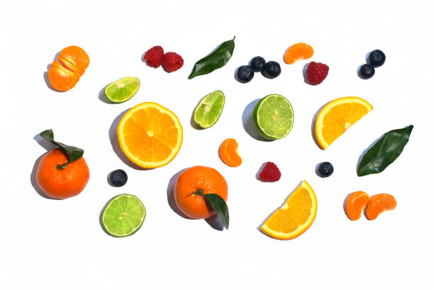 istock Colorful fresh fruit on white table background isolated. Orange, tangerine, lime, citrus, grapefruit. Fruit pattern. Summer food concept. Top view. 944352706