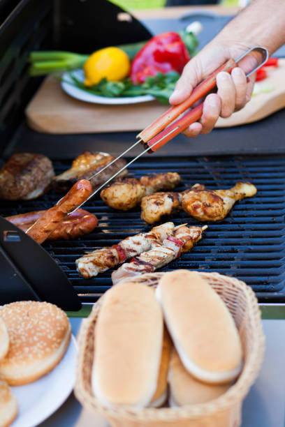 istock Barbecue grill with meet, vegetables and bread. 944355874
