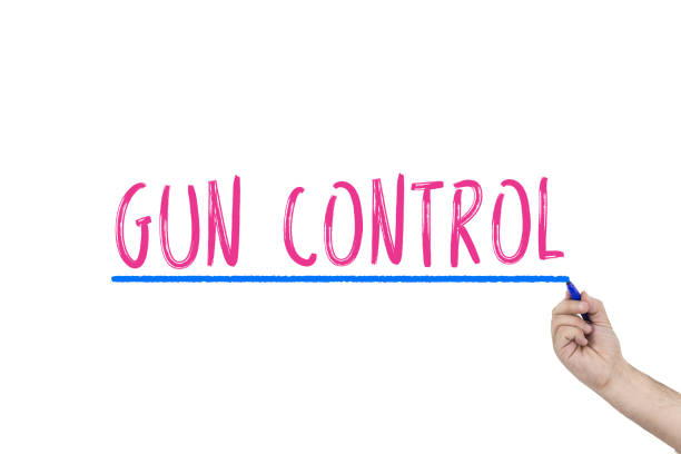 istock Human's hand writing Gun control with marker. Human rights, GUN CONTROL concept. 944372954