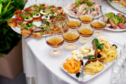 Gasses with cognac or brandy on event catering