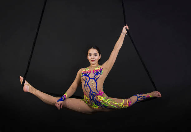 istock Aerial acrobat in the trapeze. 944377020