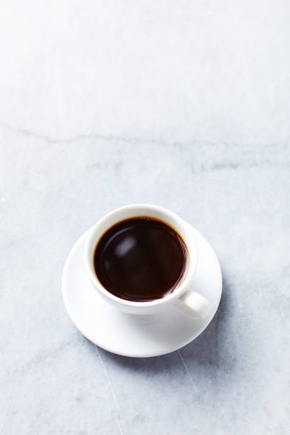 istock Cup of Black Coffee on gray marble background 944382218