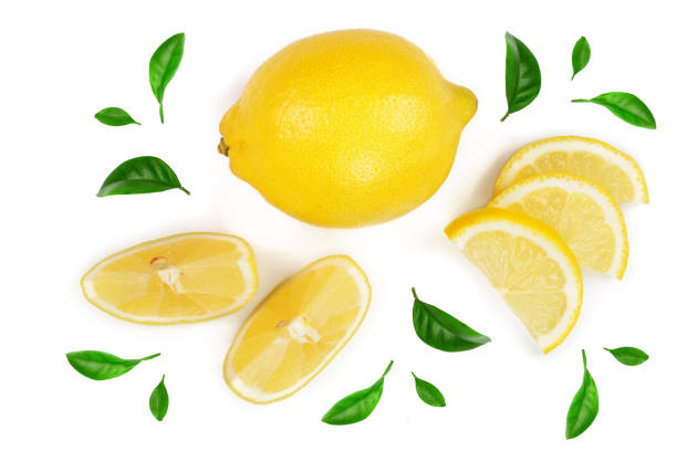 istock lemon and slices with leaf isolated on white background. Flat lay, top view 944382298