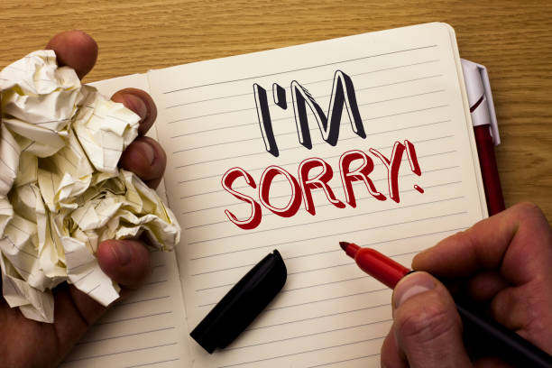istock Handwriting text I m Sorry. Concept meaning Apologize Conscience Feel Regretful Apologetic Repentant Sorrowful written by Man on Notebook Book Holding Marker on the wooden background Pen next to it. 944382782