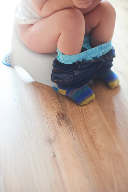 istock Toddler's legs on potty 944386376