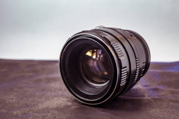 istock close up vintage camera lens on the table isolated 944389540