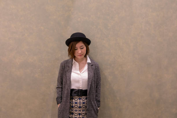 istock Young woman leaning on wall 944391118