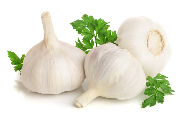 istock garlic with parsley leaf isolated on white background 944394308