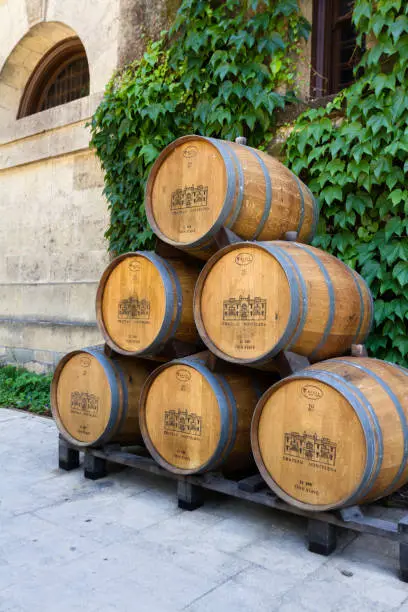 Photo of Wine barrels in a winery