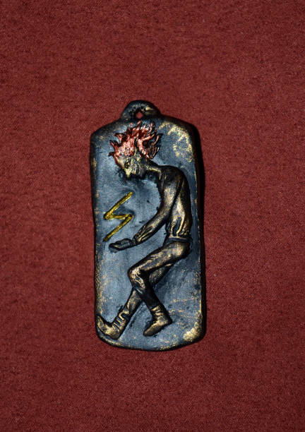 istock Pendant with a figurine and a sign 944412080