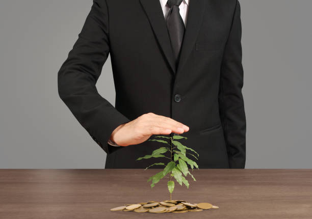istock human hand putting coin to money 944418606