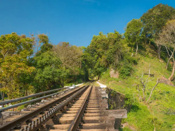 Section of the track and a bridge on the Nilgiri mountain railway at Mettupalayam. The rack and pinion railway runs between Mettupalayam and Udagamandalam also known at Ooty, in South India.