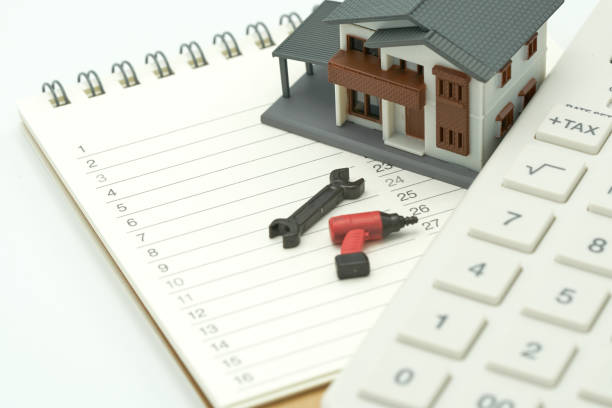 istock House Models and Equipment Models placed on a Book Rankings (list). Home Repair and Construction . using as background property real estate concept with copy space for your text or design. 944419510