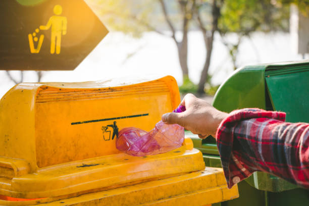 istock Child volunteer help garbage collection charity environment. 944433876
