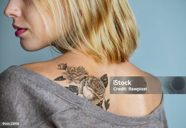 Back Tattoo Of A Woman Stock Photo - Download Image Now - Tattoo, Women, One Woman Only