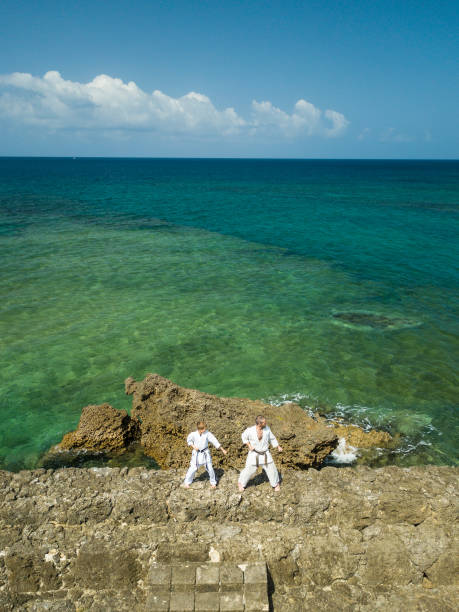 istock Sensei teaching Okinawa Karate to a child 944439640