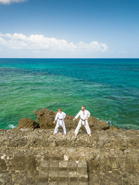 Sensei teaching Okinawa Karate to a child