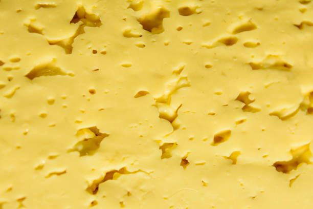 istock Texture of the sliced cheese for background 944447254