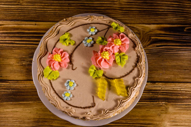 istock Kiev cake with cream on wooden table. Top view 944447326