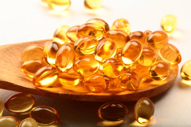 istock Spoon full of fish oil capsules. 944450240