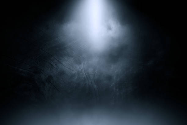 istock blue spotlight smoke studio old black wood background. 944454056