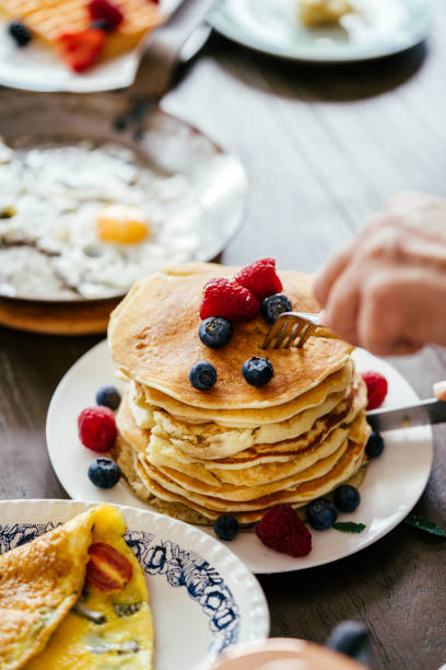 istock Stack of Pancakes with Maple Syrup and Fresh Berries 944461958