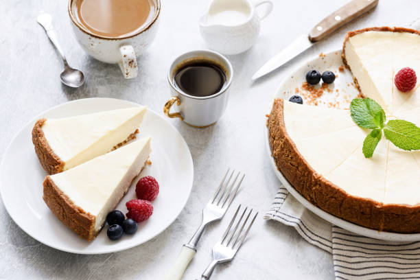 istock Classic New York Cheesecake and coffee on white concrete background 944462210