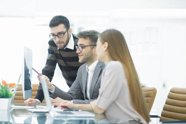 istock Group business partners discussing new project at meeting in office room 944464976