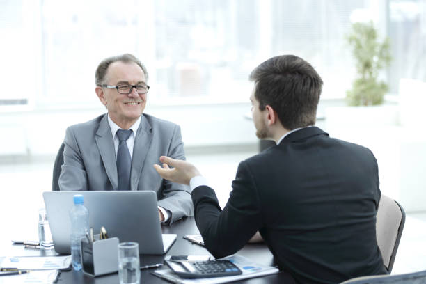 istock close up.business people talking at a Desk 944465346