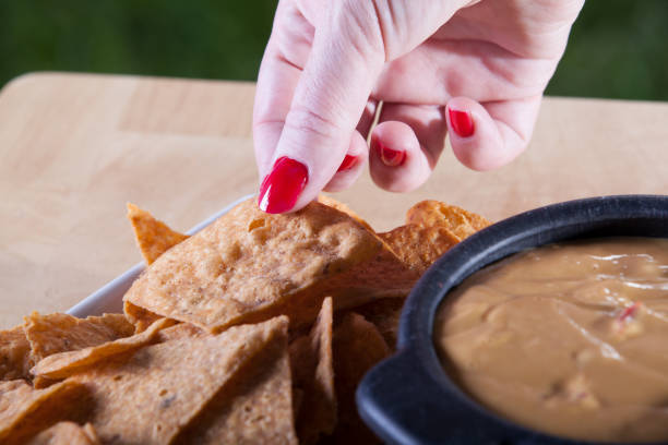 istock Woman Eating Snack Foods 944475146
