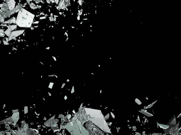 istock Broken shattered glass pieces isolated on black 944478034