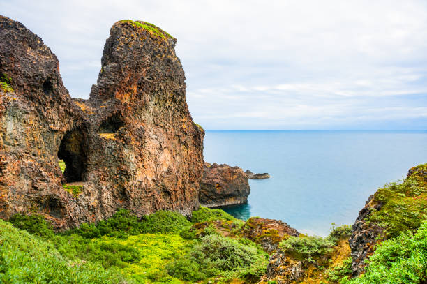 istock Basalt cliffs on the shore of Atlantic ocean 944478776