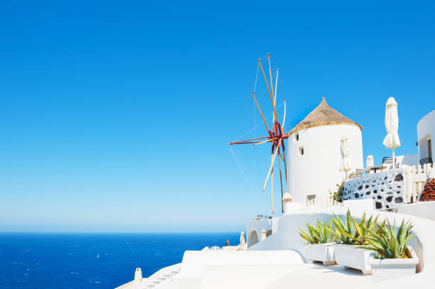 istock White windmill on Santorini island, Greece. 944478780