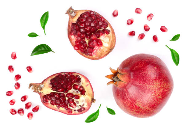 istock pomegranate with leaves isolated on white background. Top view. Flat lay pattern 944481350