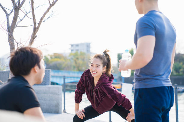 istock Young people are stretching outdoors 944482914