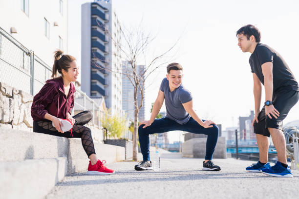 istock Young people are stretching outdoors 944482930