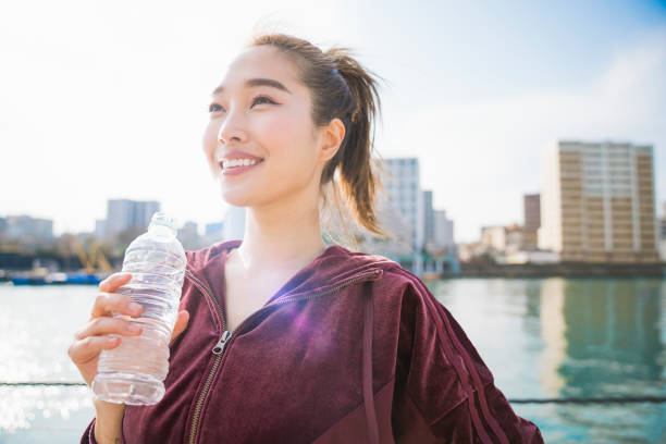Young woman drinking water