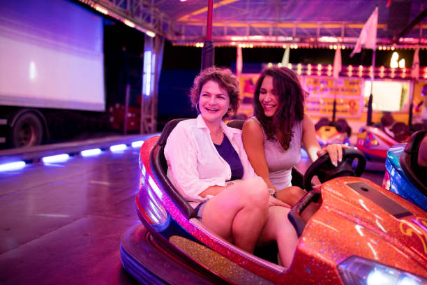 istock Friends riding bumper cars 944486574