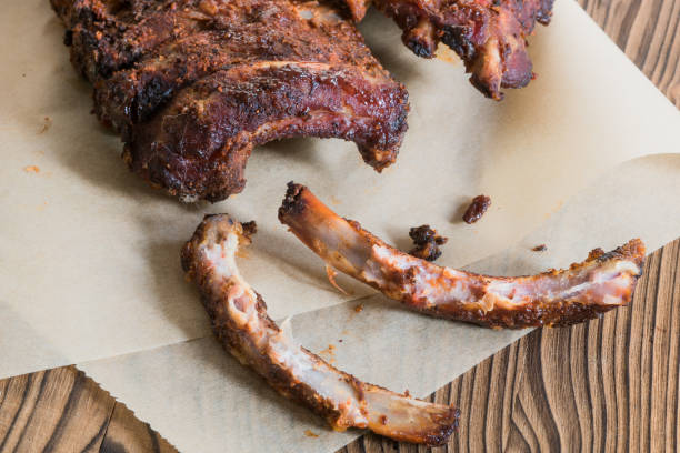 istock Grilled Spareribs with gnawed bones on backed paper 944486698