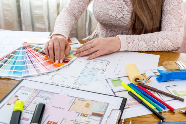 istock Designer showing colour swatch, choose colour for renovation 944487176