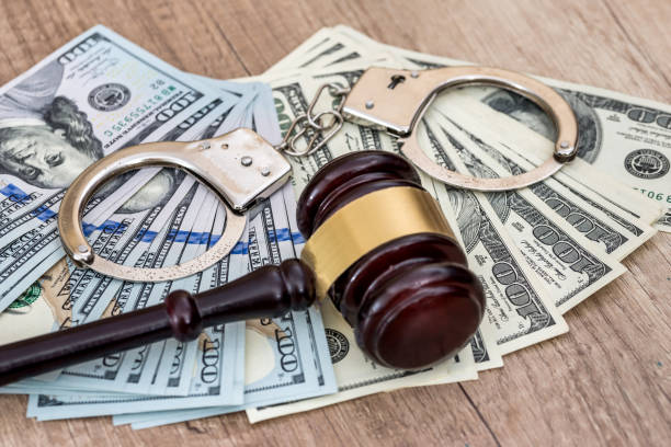 istock Criminal concept, punishment. Dollar bribe, handcuffs and gavel 944490244